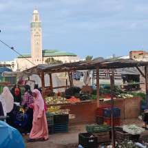 Street market close to Casablanca's old town with the 210 meters high minaret of the Hassan II Mosque